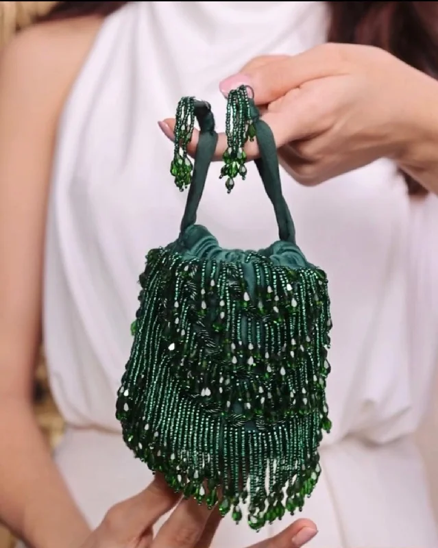 Color - blocked bucket bag with bold and bright hues for a statement pieceAndromeda Mini Emerald Tassels Bucket Bag