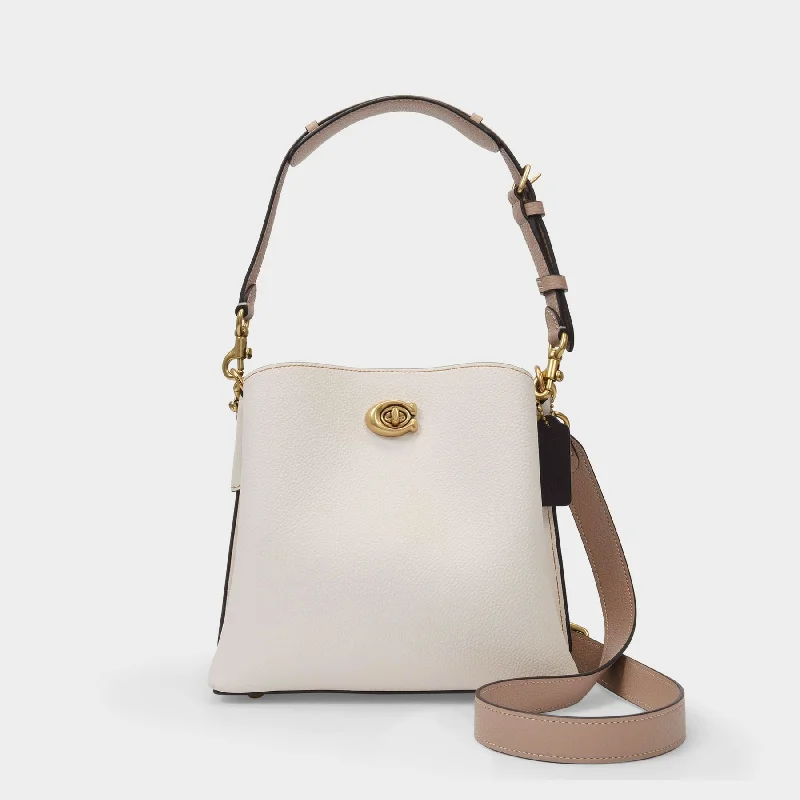 Hobo bag with a large capacity and multiple interior pockets for organizationWillow Bucket Bag - Coach - Cream - Leather