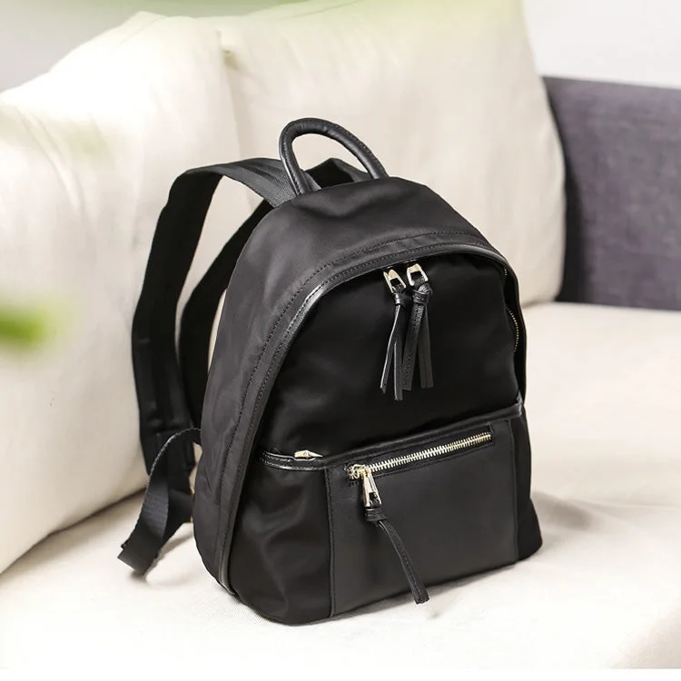 Canvas laptop bag with a padded sleeve and a zip - around closureChic Women's Nylon Backpack Waterproof Black Bookbag