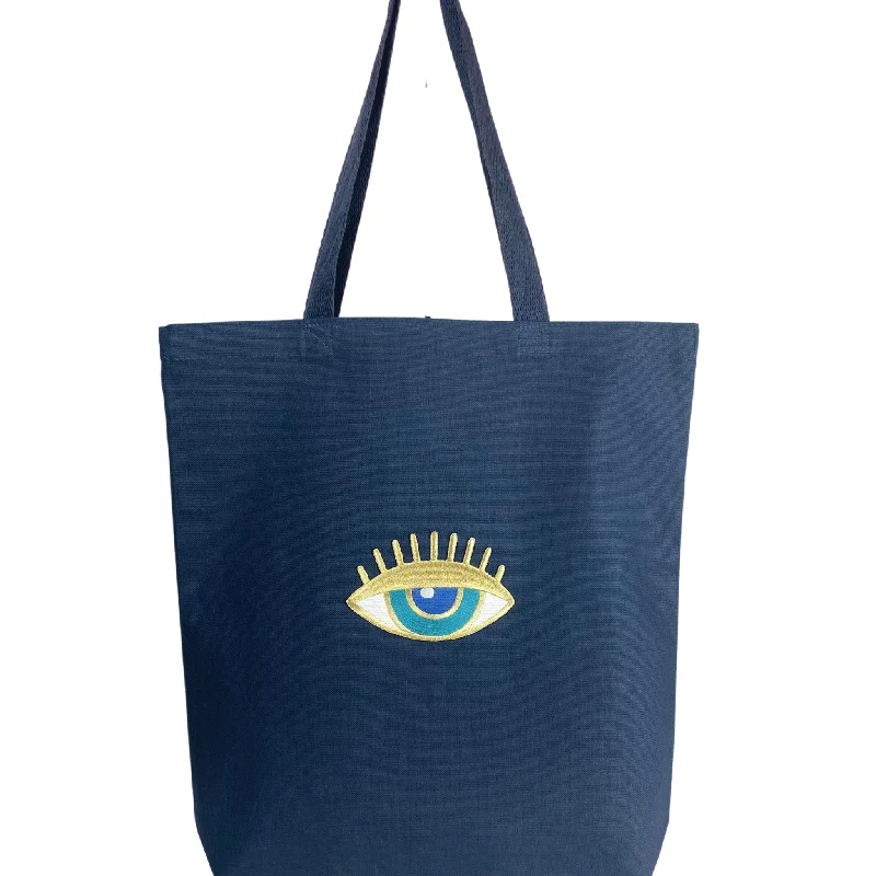 Canvas beach bag with a colorful stripe design and a waterproof liningLarge Eye Dark Blue Canvas Tote Bag