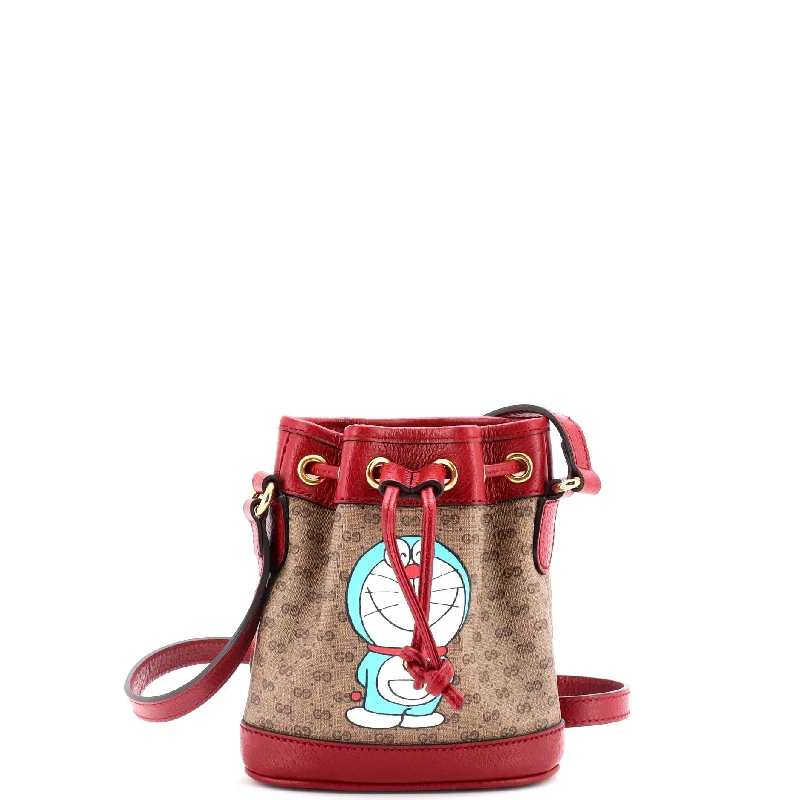 Vintage - style bucket bag with a brass clasp and leather strapsDoraemon Bucket Bag Printed Mini GG Coated Canvas Mini