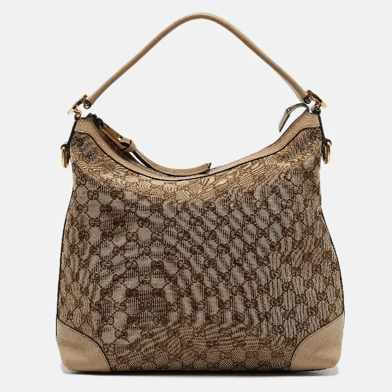 Hobo bag with a tassel - trimmed strap for a playful touchGucci Beige Gg Canvas And Leather Miss Gg Hobo