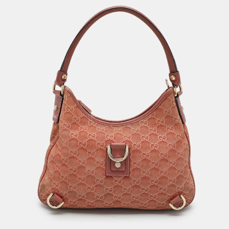 Metallic hobo bag with a shiny finish for evening outingsGucci Pink Guccisssima Suede Abbey D-Ring Hobo