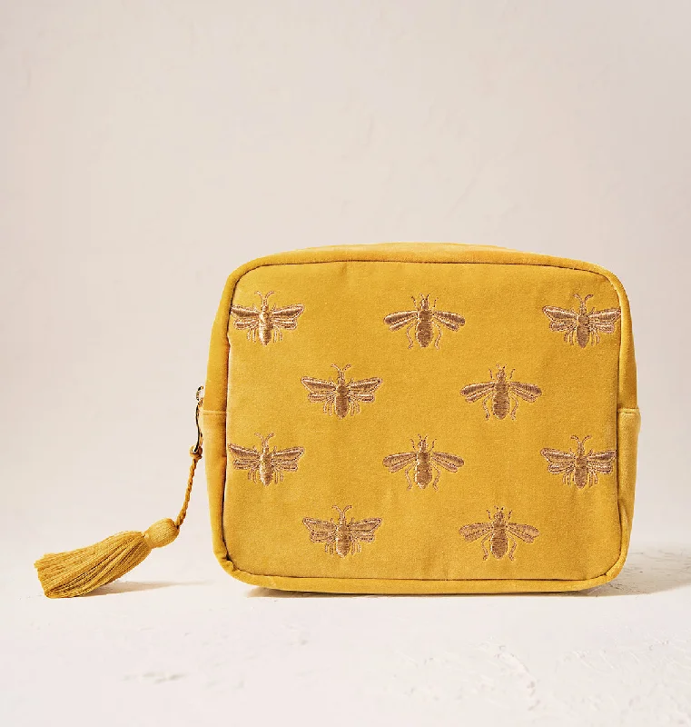 Leatherette makeup bag with a quilted pattern and a magnetic closureHoney Bee Wash Bag