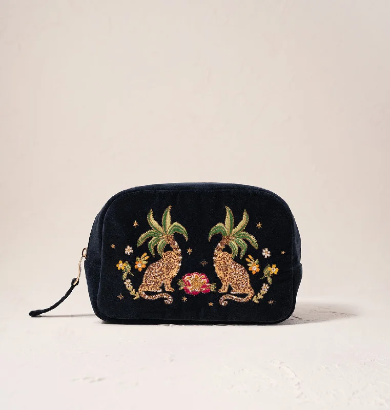 Vintage-inspired leather makeup bag with a brass clasp and tasselTropical Jaguar Makeup Bag