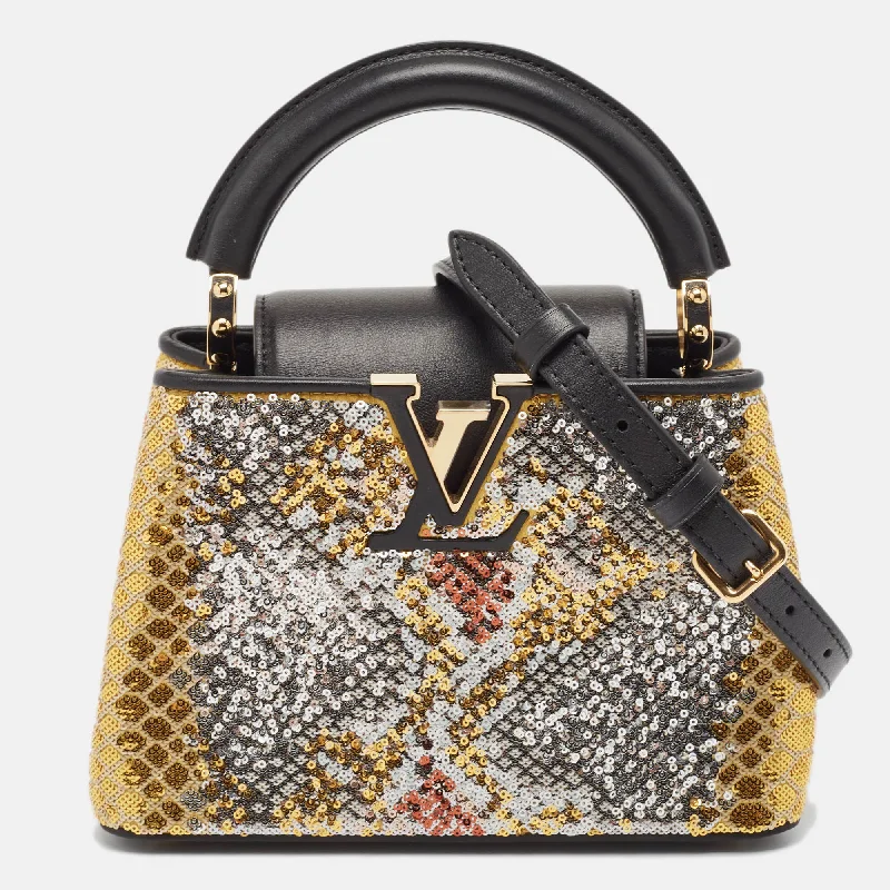 Faux fur hobo bag with a fluffy texture for a winter fashion statementLouis Vuitton Multicolor Sequin And Leather Mini Capucines Bag