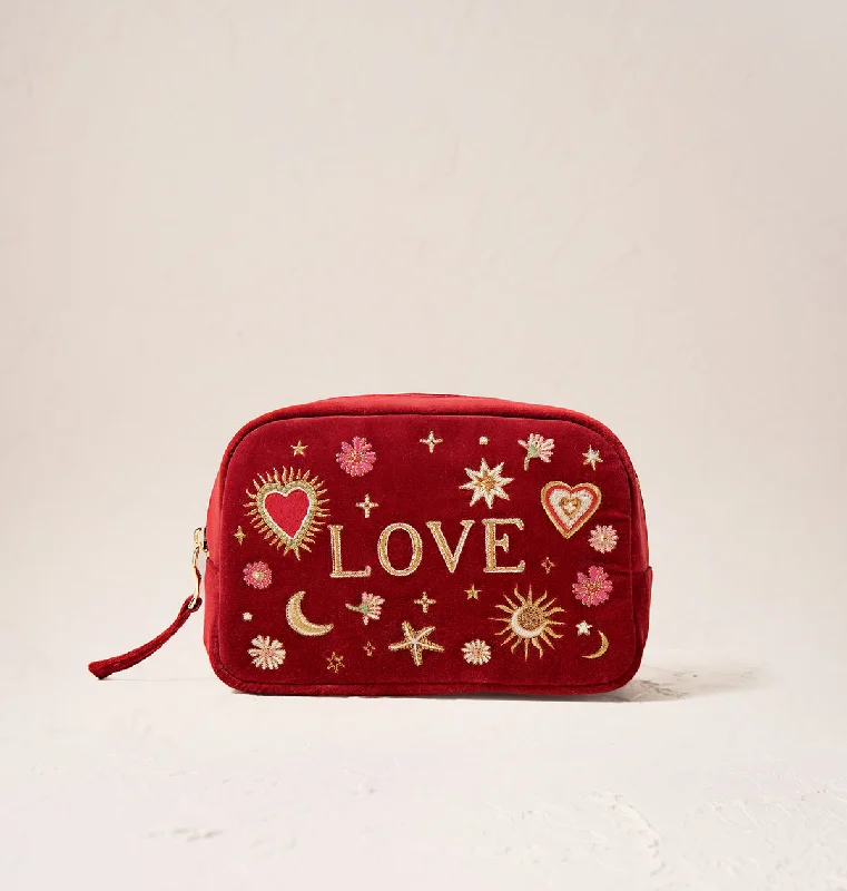 Vintage-inspired leather makeup bag with a brass clasp and tasselLove Charm Makeup Bag