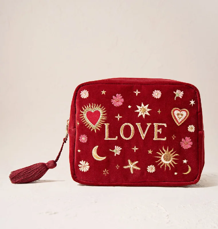 Women's leather makeup bag with a hand-stitched border and gold zippersLove Charm Wash Bag