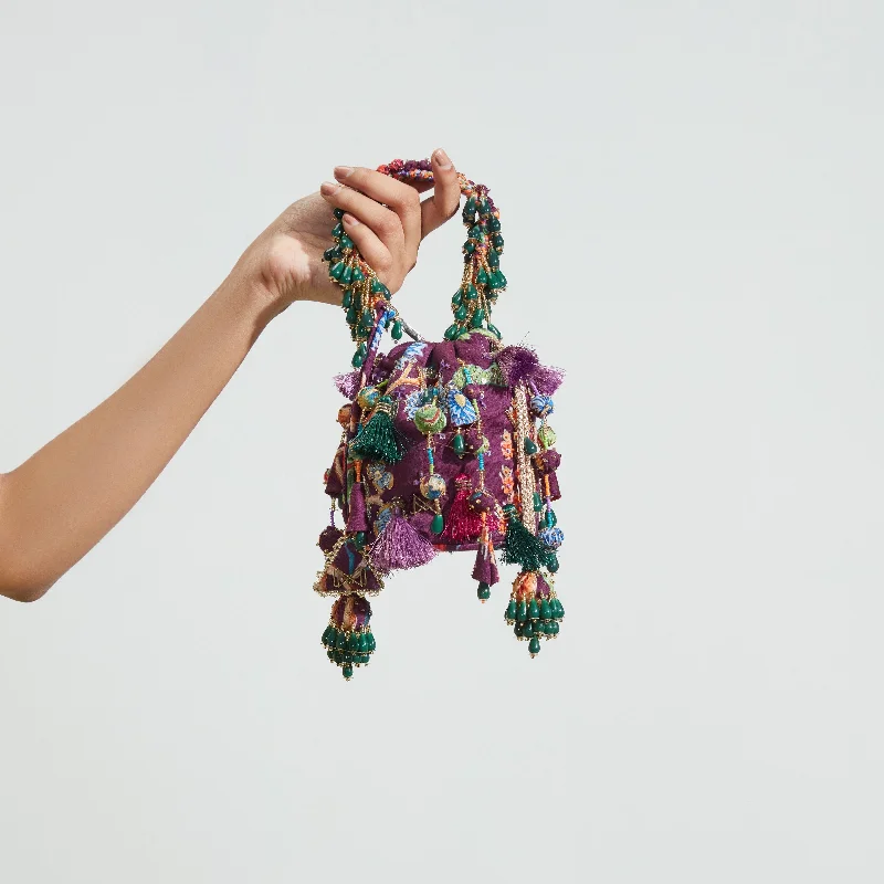 Laser - cut leather bucket bag with an intricate patternPurple Bucket Bag