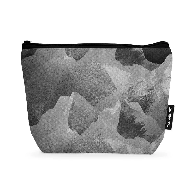 Leatherette makeup bag with a quilted pattern and a magnetic closureMakeup Pouch The grey rocks