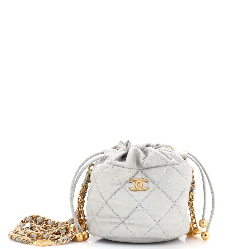 Vintage - style bucket bag with a brass clasp and leather strapsMedallion Charms Drawstring Bucket Bag Quilted Caviar Mini