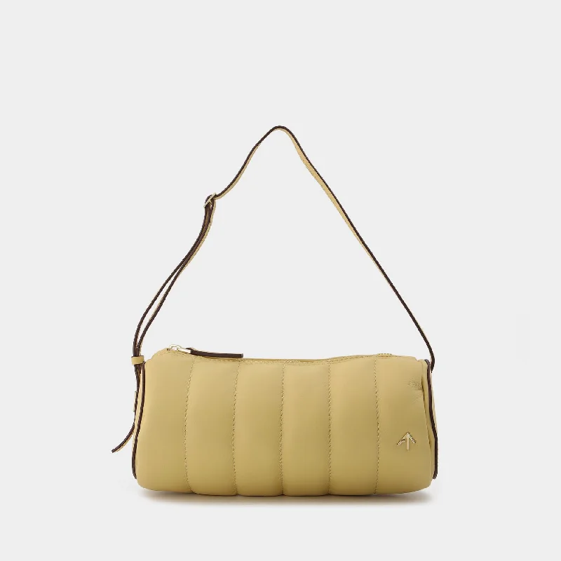 Vegan leather hobo bag for eco - conscious consumersPadded Cylinder Bag in Cream Leather