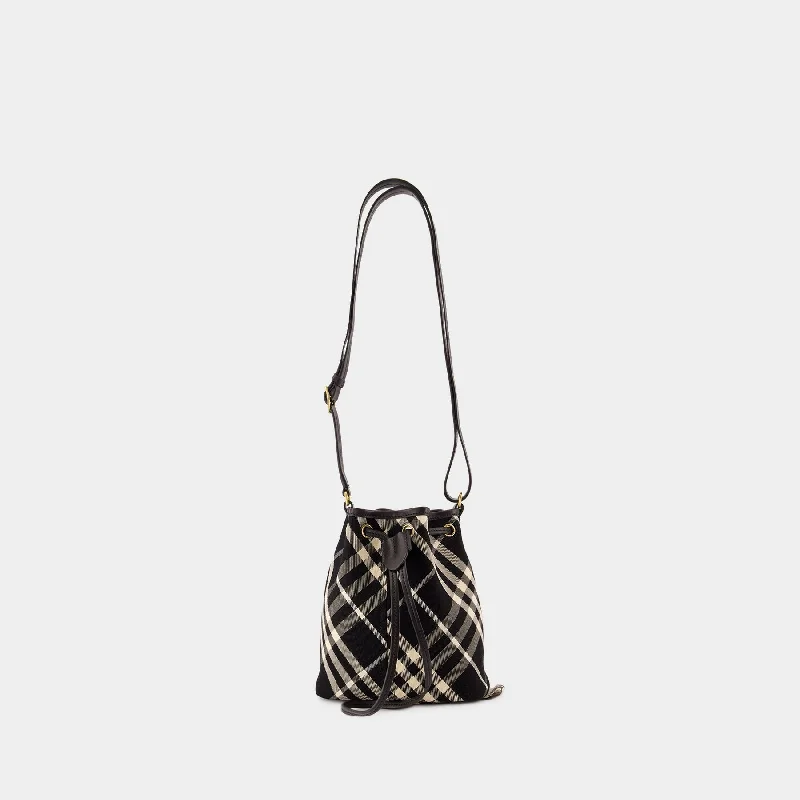 Studded hobo bag with a punk - rock edgeDrawstring Bucket Bag - Burberry - Cotton - Black