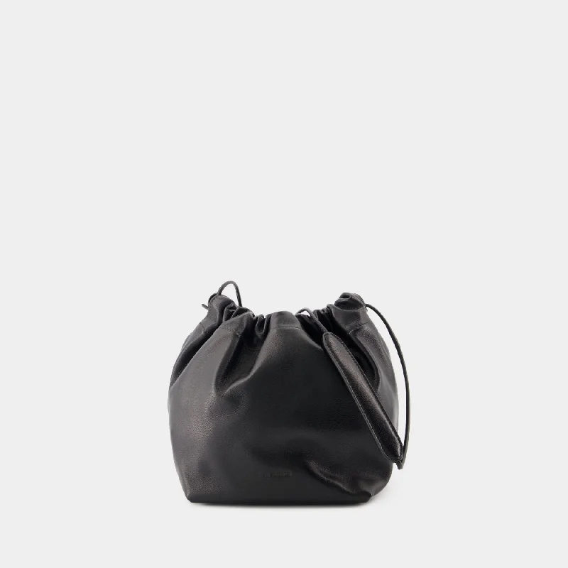 Hobo bag with a large capacity and multiple interior pockets for organizationDumpling Shoulder Bag - Jil Sander - Leather - Black