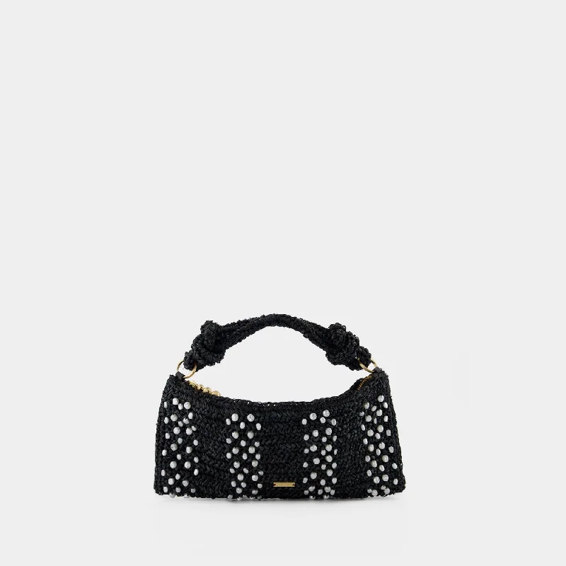 Studded hobo bag with a punk - rock edgeHera Nano Shoulder Bag - Cult Gaia - Raffia - Black