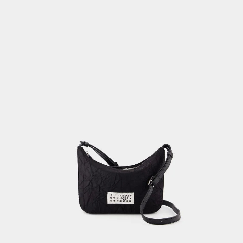 Hobo bag with a tassel - trimmed strap for a playful touchNumeric Shoulder Bag - MM6 Maison Margiela - Nylon - Black