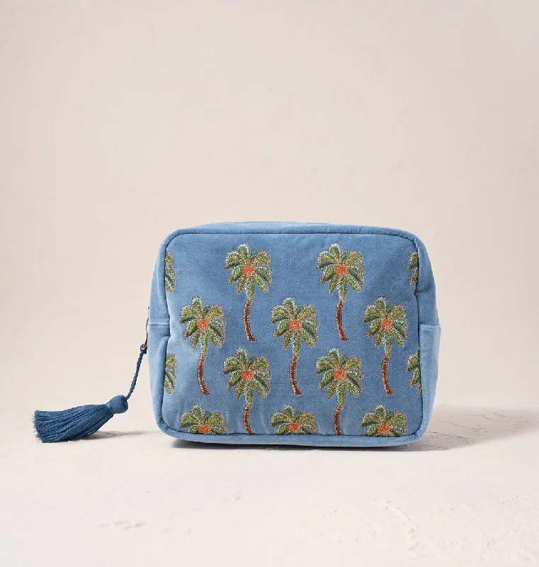 Leatherette makeup bag with a quilted pattern and a magnetic closureSunset Palm Wash Bag