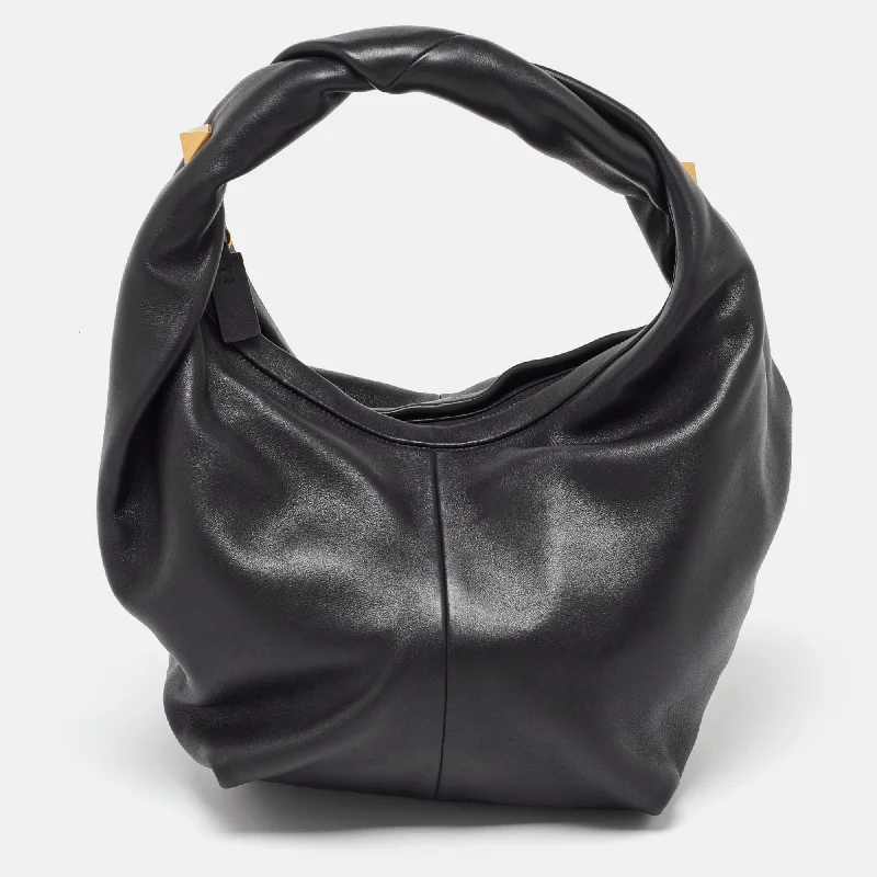 Women's leather hobo bag with a distressed finish for a vintage lookValentino Black Leather Rockstud Hobo