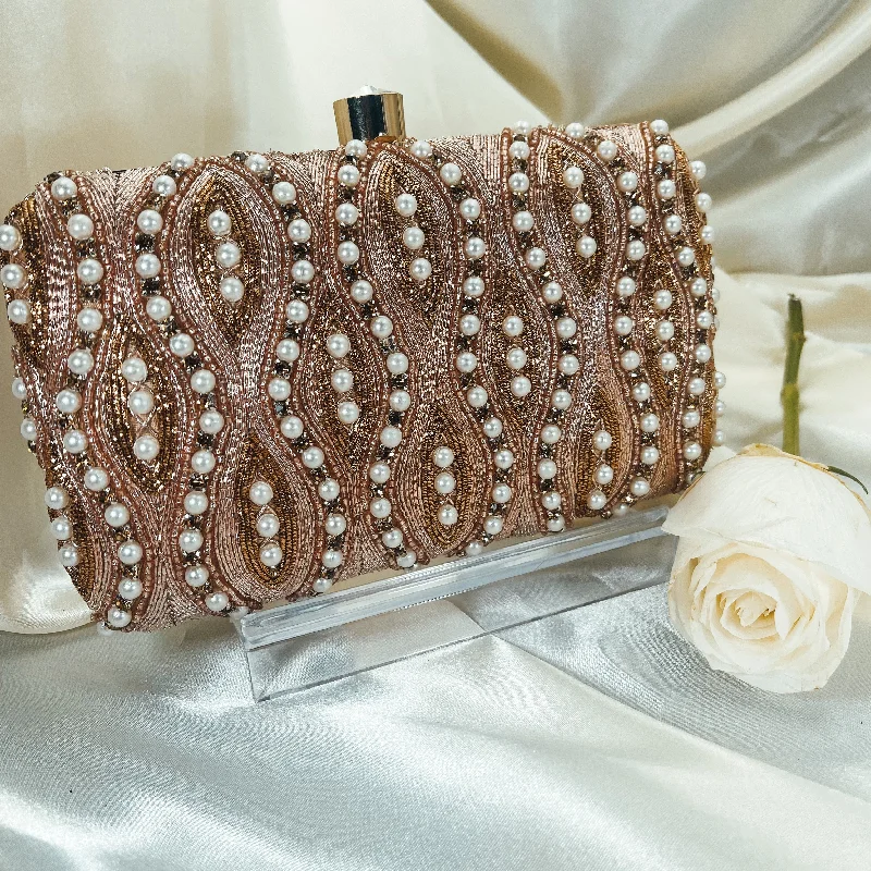 Patent leather clutch with a modern, minimalist designAHANA Clutch (Rose Gold)