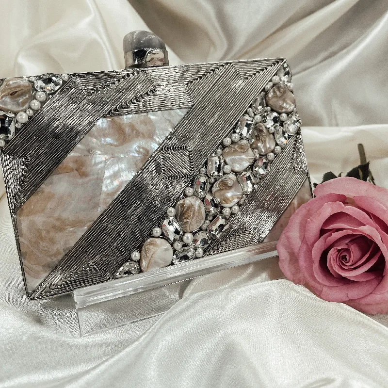 Two - tone clutch with a contrast color lining for added styleANILA Clutch (Silver)