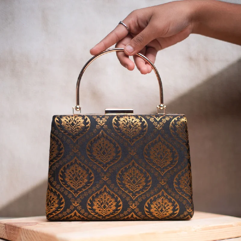 Clutch with a removable strap to be used as a hand - held or cross - bodyArtklim Black and Golden Brocade Party Clutch