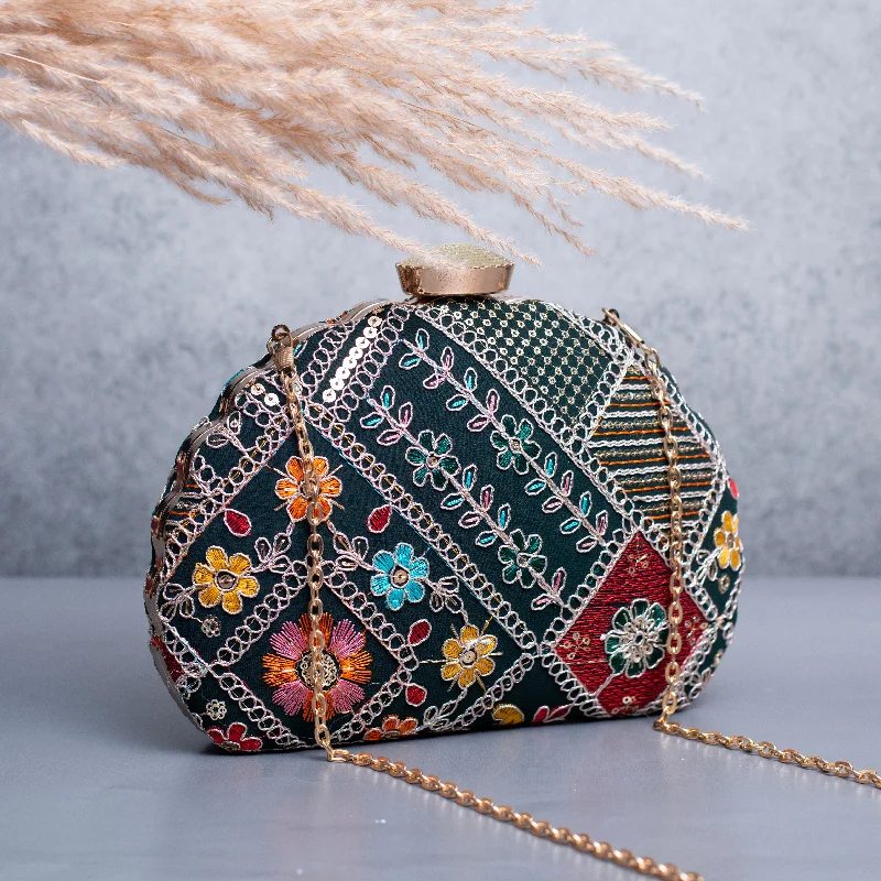 Velvet clutch with a tassel detail for a bohemian - chic styleArtklim Dark Sea Green Based Floral Pattern Embroidery Clutch