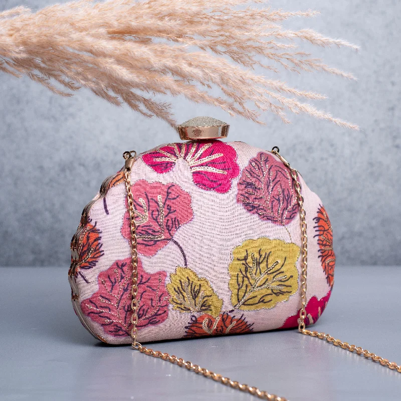 Patent leather clutch with a modern, minimalist designArtklim Light Pink Based Floral Golden Zari Embroidery Clutch