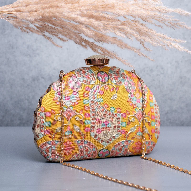 Monogrammed clutch as a personalized evening accessoryArtklim Yellow Based Pink Printed Golden Zari Embroidery Clutch