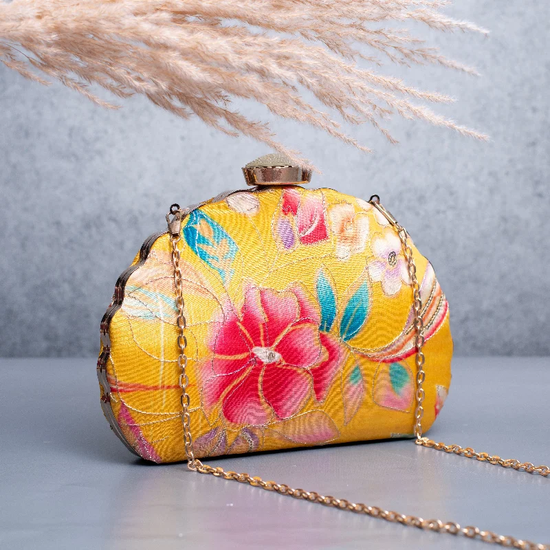 Patent leather clutch with a modern, minimalist designArtklim Yellow Based Red Floral Printed Golden Zari Embroidery Clutch