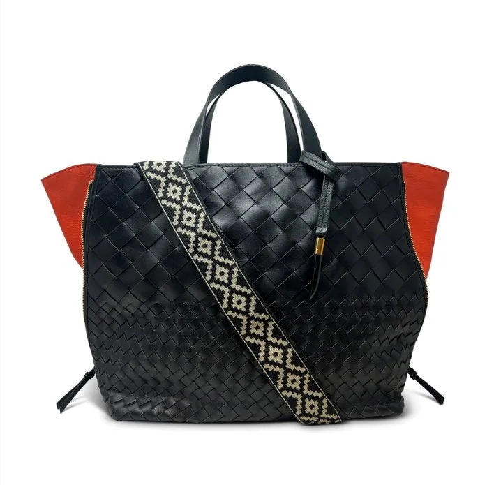 Patent leather handle bag in a bright red color for a bold fashion statementBantham Tote Black Threaded Weave