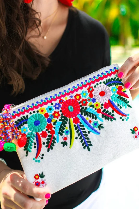 Clutch with a removable strap to be used as a hand - held or cross - bodyCancun Embroidered Clutch In White/multi