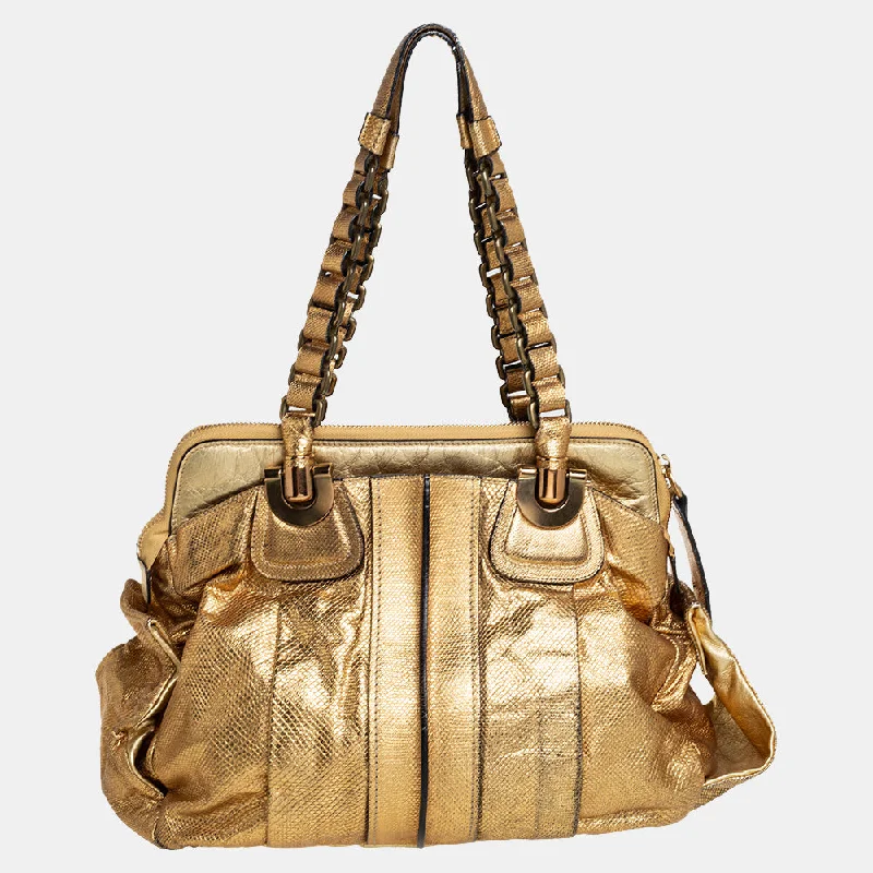 Leatherette satchel with a quilted pattern for a sophisticated styleChloé  Gold Embossed Leather Heloise Satchel