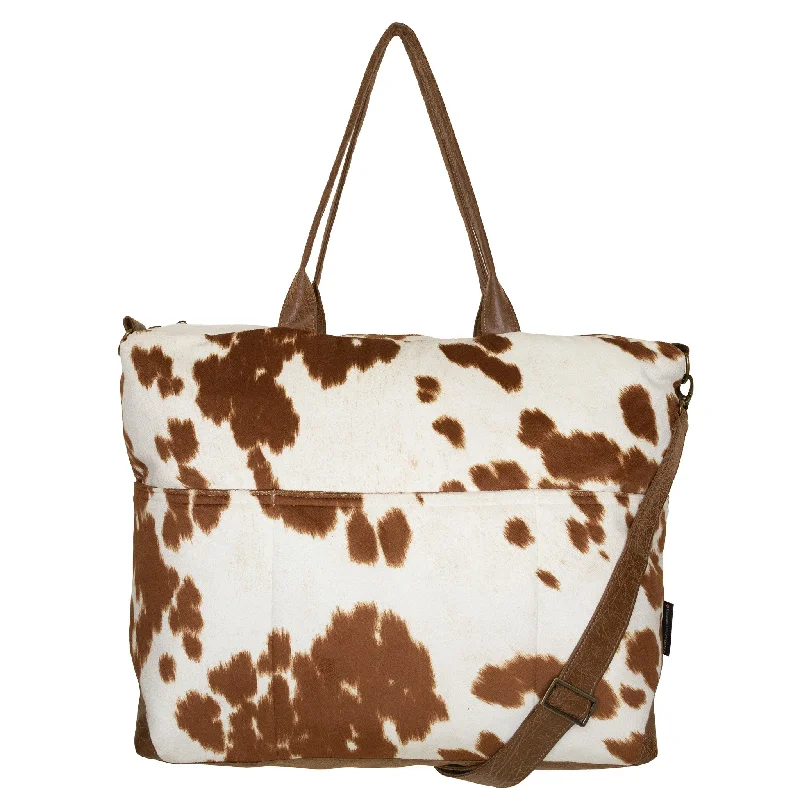 Vintage - style crossbody bag with a brass frame and leather strapsElizabeth: Longhorn Cowhide