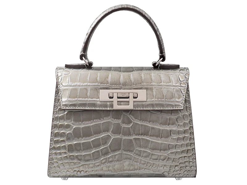 Vintage - style canvas shoulder bag with a brass clasp and frayed edgesFonteyn Midi Orinoco - Silver