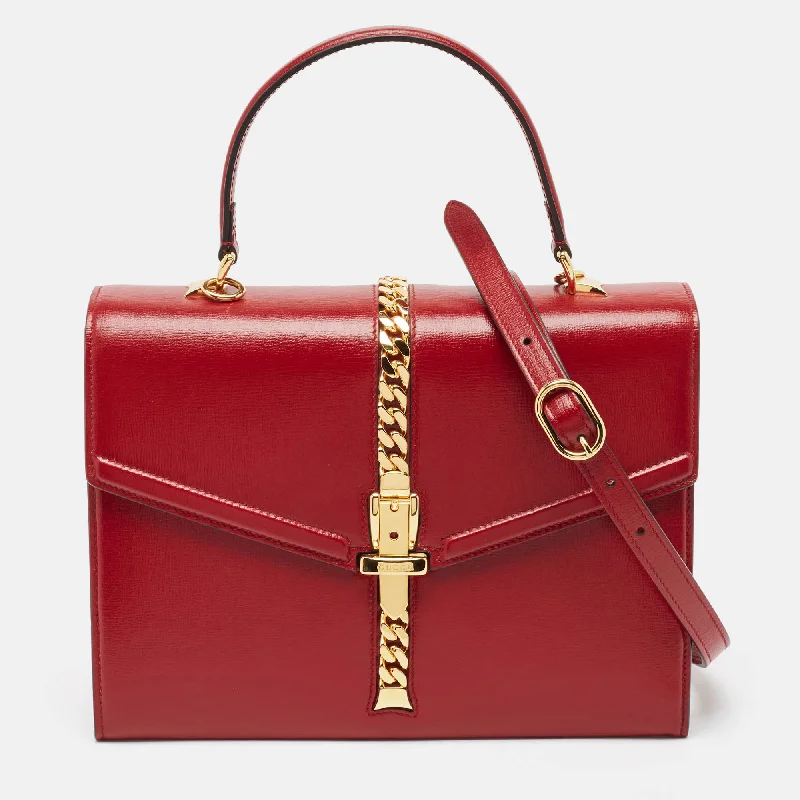 Satchel with a hidden anti-theft pocket for securityGucci Red Leather Sylvie 1969 Top Handle Bag