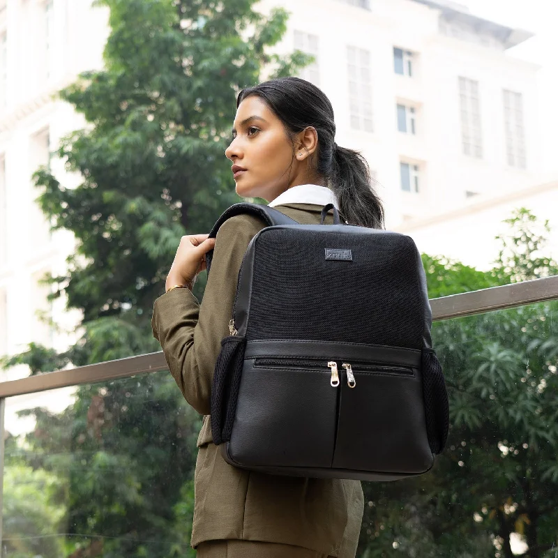 Vintage - inspired leather backpack with a flap - over closure and tassel detailsJet Black Office Backpack