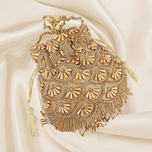 Embroidered silk clutch with a traditional motif for a cultural touchJYOTI Potli (Copper)