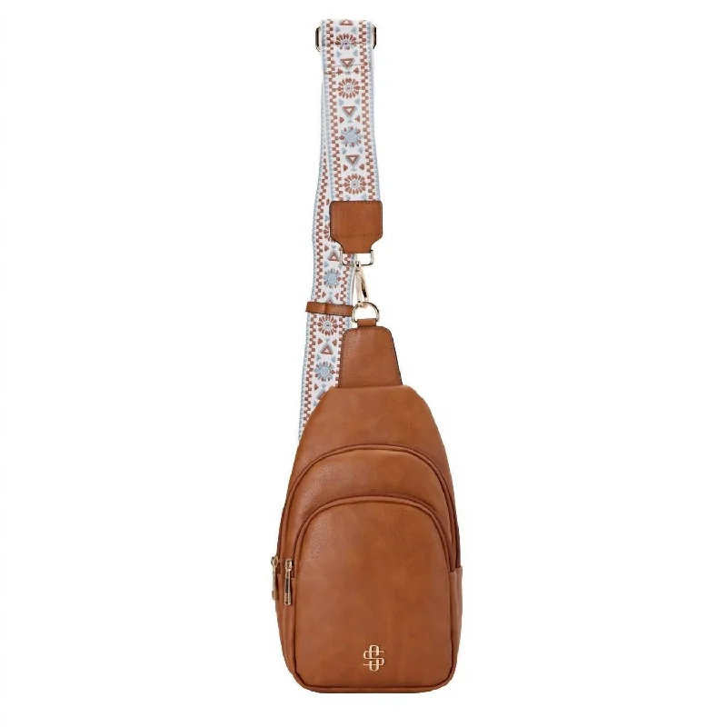 Crossbody bag with a magnetic snap closure for quick accessLeather Sling Bag In Fawn