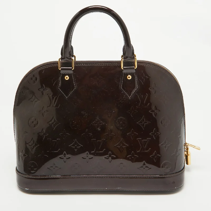 Vintage-inspired satchel with a brass buckle and leather tasselsLouis Vuitton Amarante Monogram Vernis Alma Pm Bag..