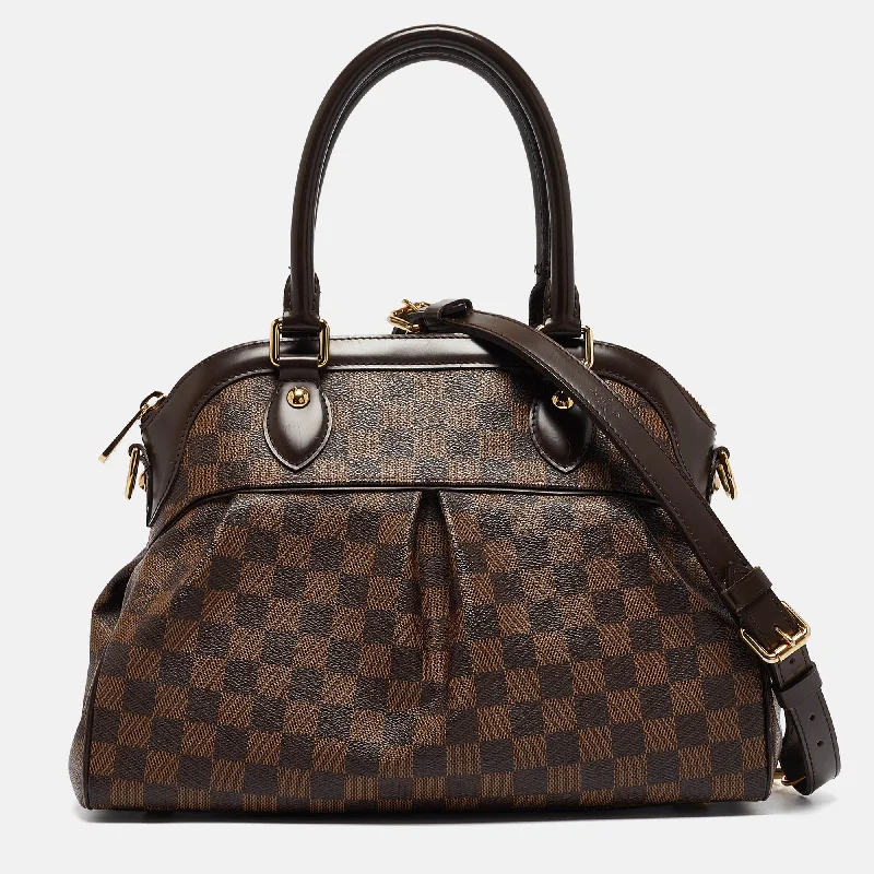 Studded satchel with a punk-rock edgeLouis Vuitton Damier Ebene Canvas Trevi Pm Bag