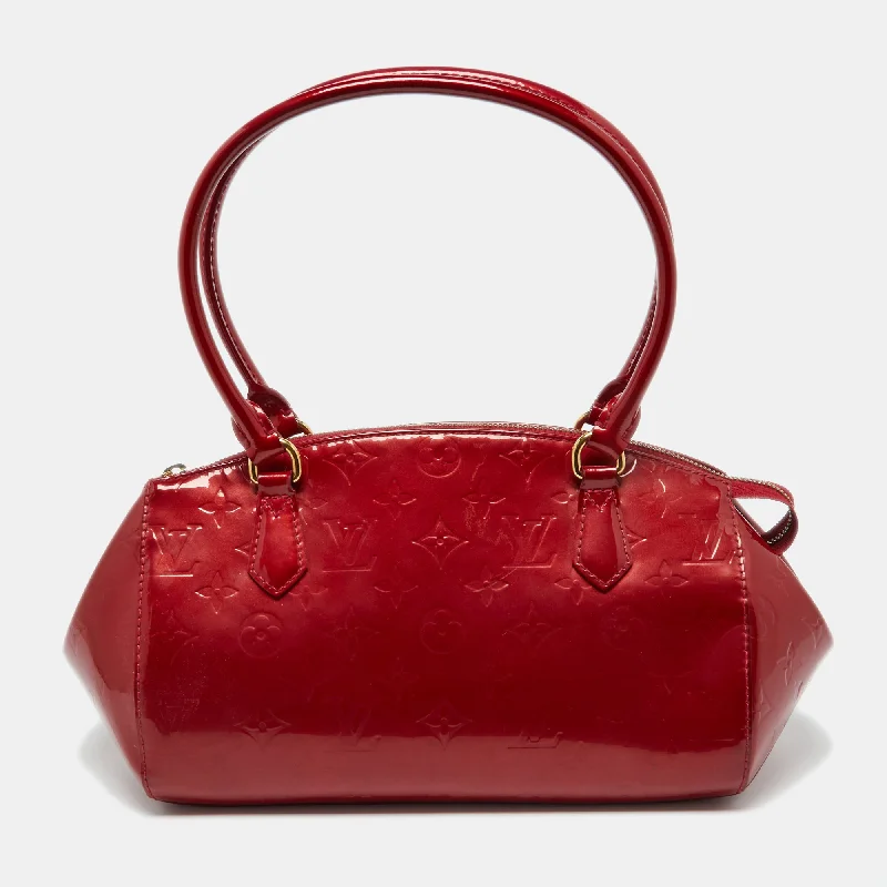 Laser-cut leather satchel with an intricate geometric designLouis Vuitton Pomme D’amour Monogram Vernis Sherwood Pm Bag