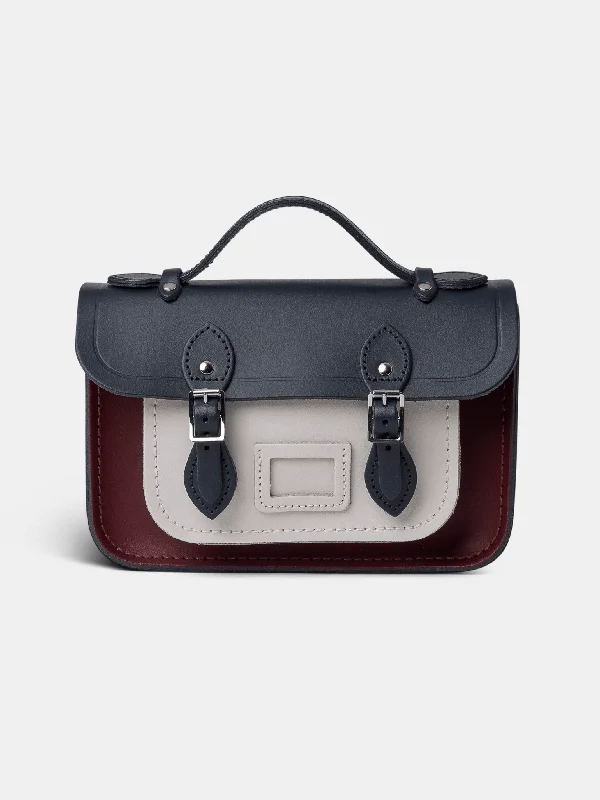 Vintage - style leather handle bag with a structured silhouette and a tassel charmThe Mini -  Clay, Oxblood & Navy