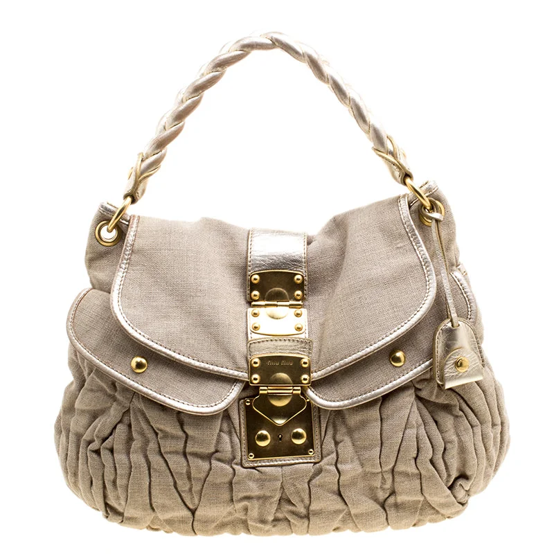 Plus-size satchel with a spacious interior for carrying all essentialsMiu Miu  Canvas Coffer Hobo