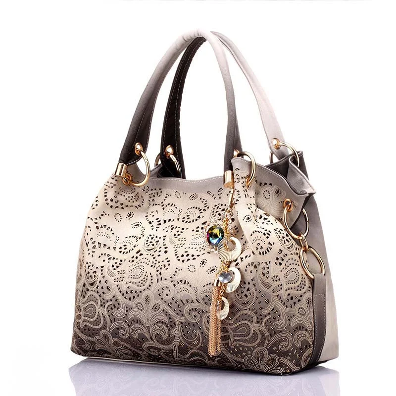 Women's studded leather shoulder bags with a punk - rock edgeNew Women's Vintage Hobo Floral Hollow Out Shoulder Bags Ladies PU Leather Polyester Tote Bag with Tassel