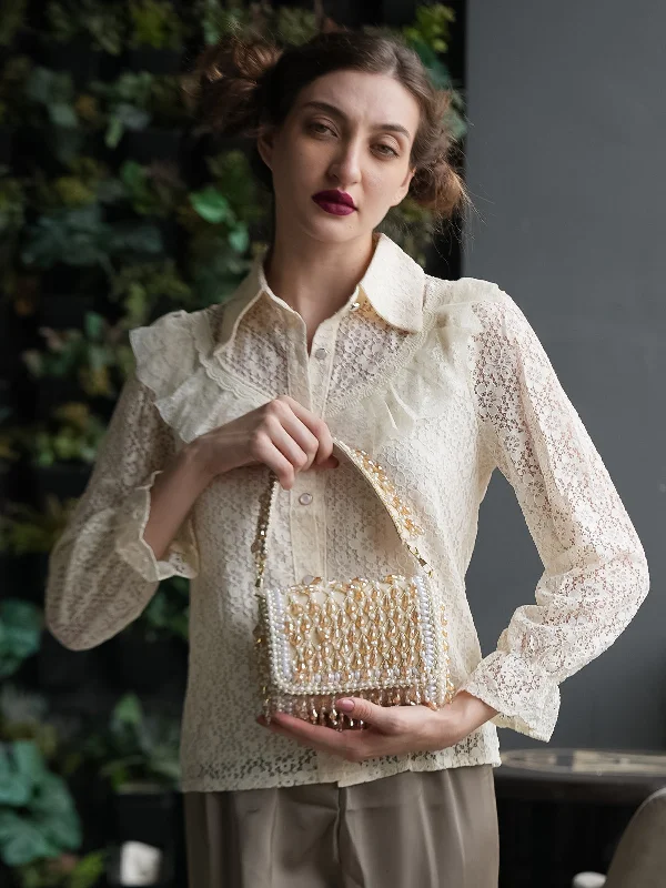 Mother - of - pearl clutch with a delicate sheenOdette Off White Tassels Embellished Clutch For Women