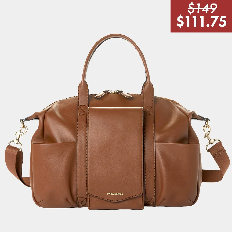 Convertible handle bag that can be worn as a shoulder bag with an adjustable strapPeek-A-Boo Vegan Leather Diaper Bag Satchel 2.0 in Toffee