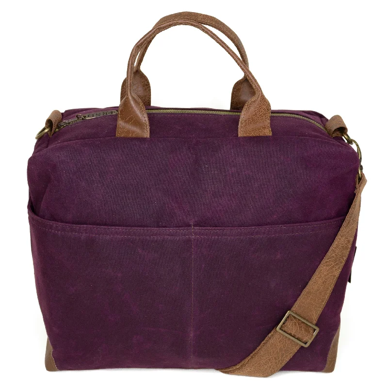 Crossbody bag with a magnetic snap closure for quick accessPoppi Pro Premier Purse: Eggplant Waxed Canvas