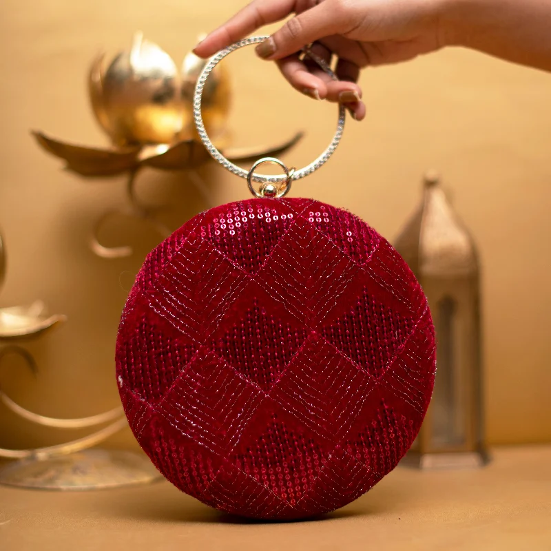 Velvet clutch with a tassel detail for a bohemian - chic styleRed and Silver Embroidery Round Clutch