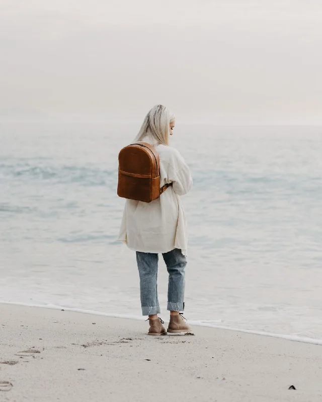 Leatherette backpack with a quilted texture and a magnetic snap closureSahara Backpack