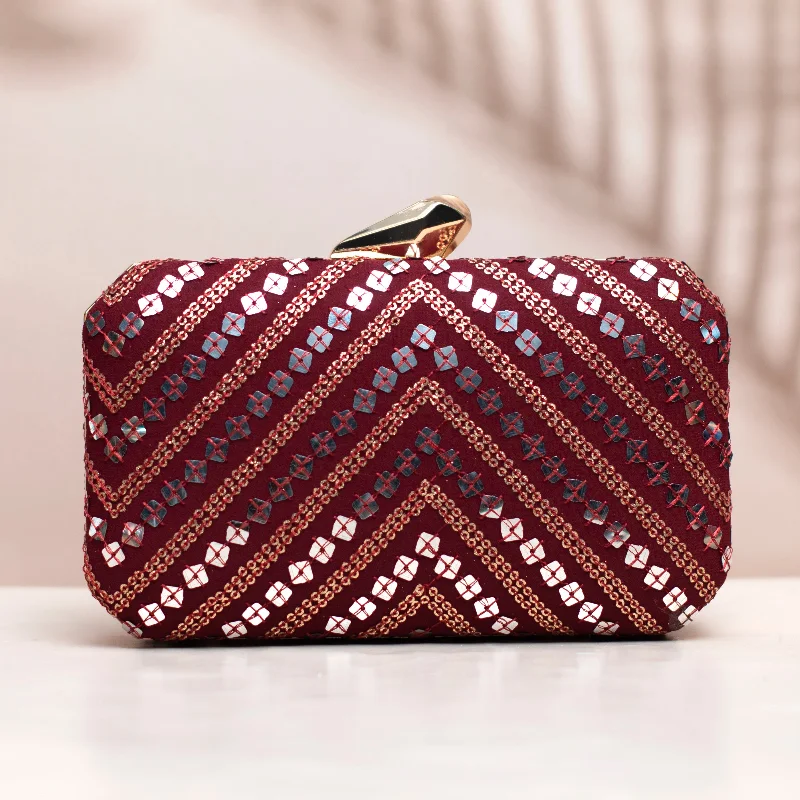 Clutch with a removable strap to be used as a hand - held or cross - bodySilver Sequins Maroon Embroidery Clutch